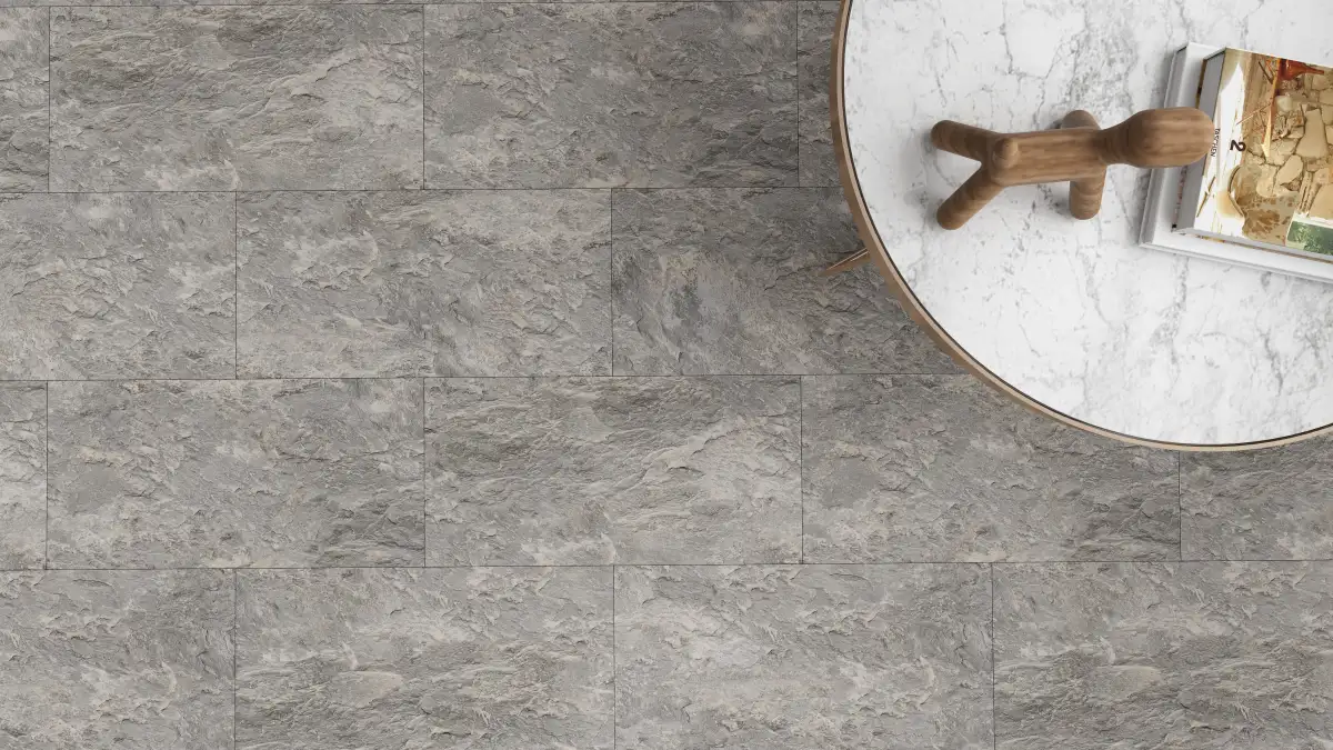 Stone-look SPC tile flooring sample in a rectangular format