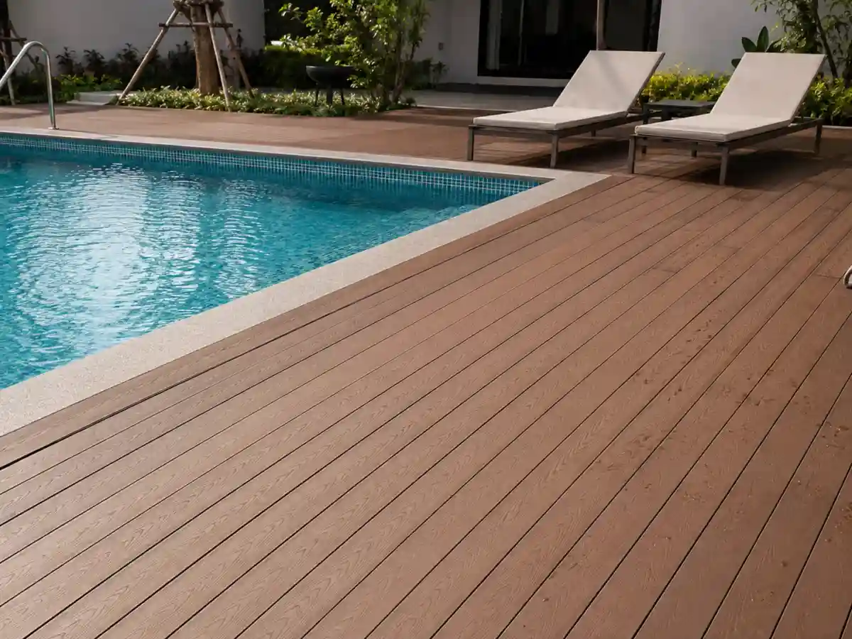 Capped composite decking around a swimming pool