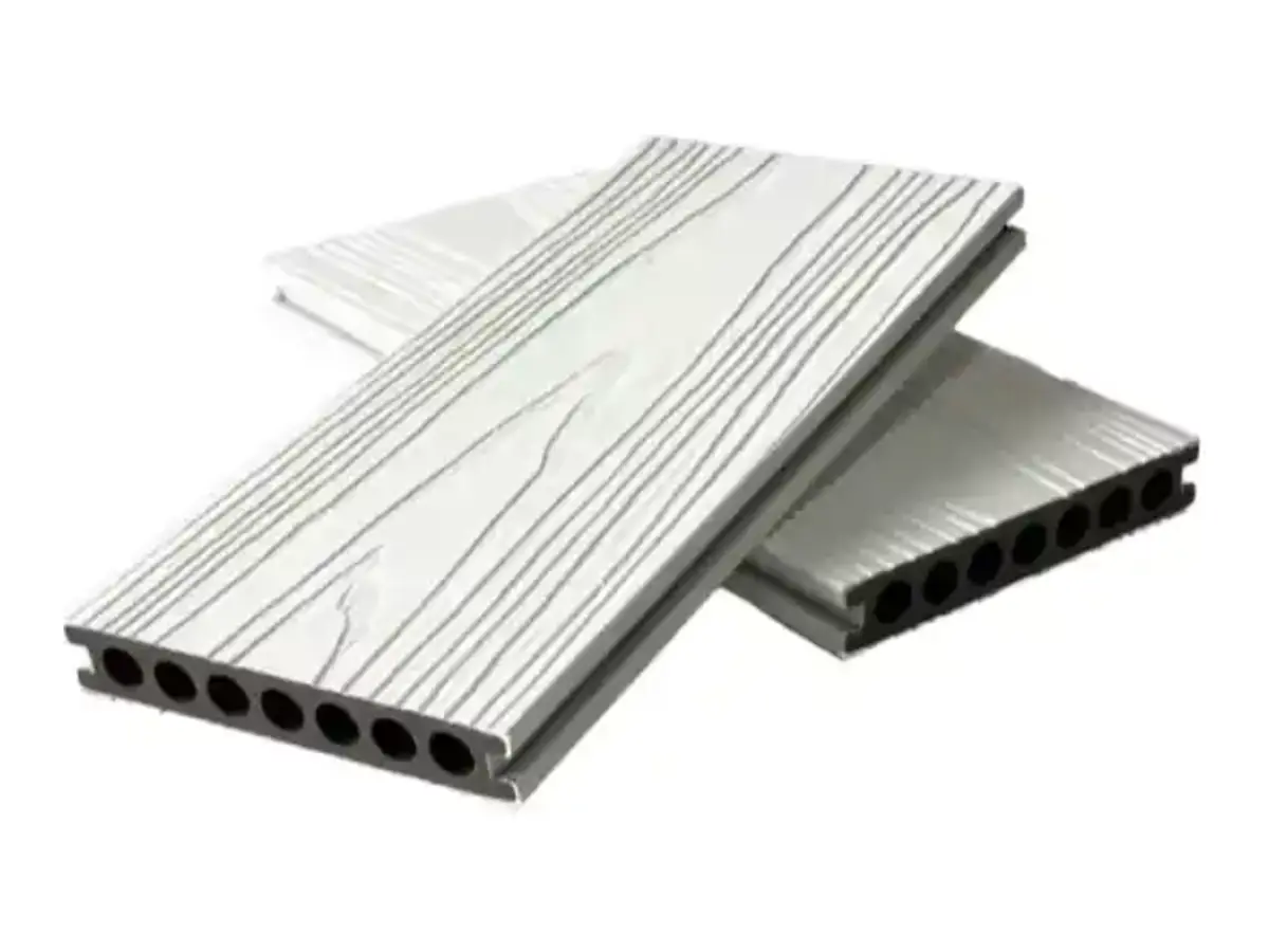 Rubber-capped composite decking boards with wood grain finish