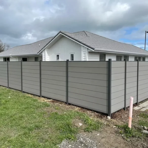 Composite fence corner installation with horizontal WPC boards and aluminum posts