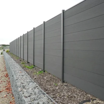 Completed composite fencing installation with aluminum posts and horizontal WPC boards