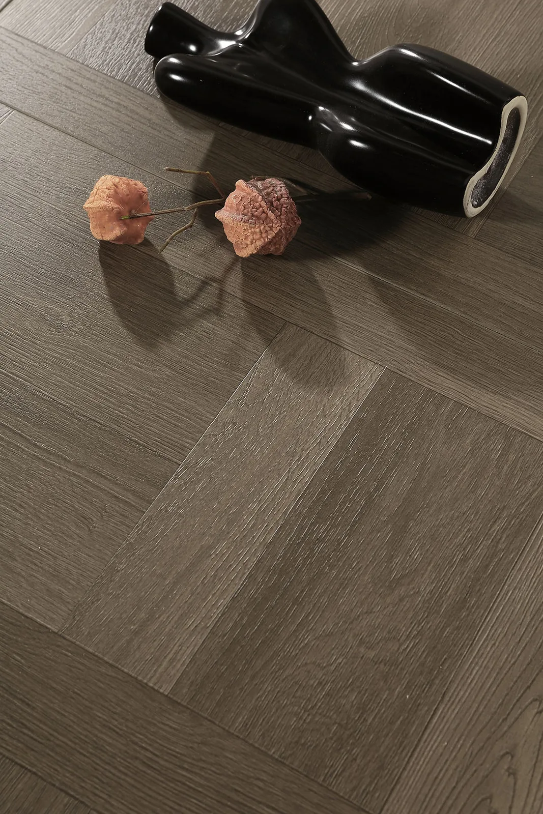 Dark brown parquet LVT flooring installed in a square wood-grain pattern