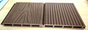 Brown WPC fencing boards with wood-grain and grooved surface finishes
